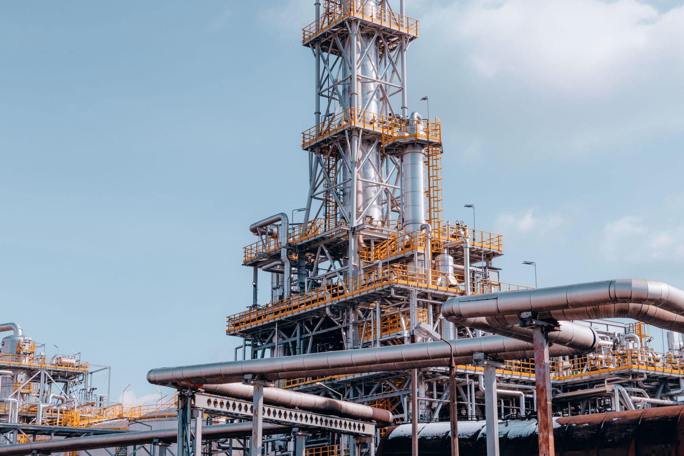 Process towers and pipework of a refinery unit