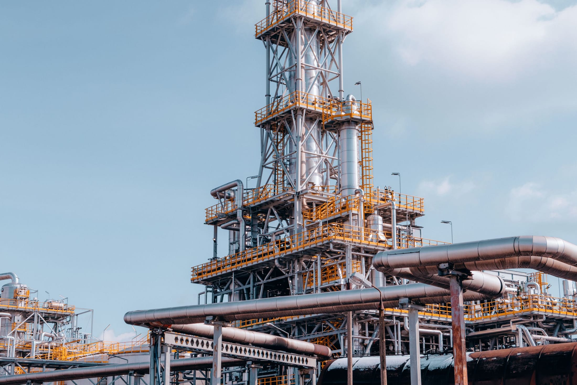 Process towers and pipework of a refinery unit