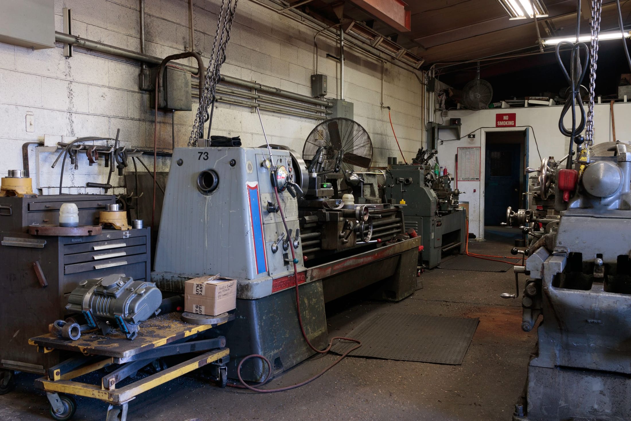 Metalworking workshop with machine tools and lifting equipment
